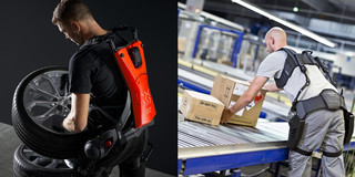 Foto, das zwei Männer zeigt, die Exoskelette tragen und schwere Gegenstände heben. Der Mann links hebt einen großen Autoreifen, während er ein Exoskelett mit einem roten Rückenmodul trägt. Der Mann rechts bewegt Kartons auf einem Förderband in einer industriellen Umgebung und trägt ein Exoskelett mit schwarzem Rückenmodul. Beide Exoskelette unterstützen die Träger bei körperlich belastenden Arbeiten, um deren Rücken und Gelenke zu entlasten.