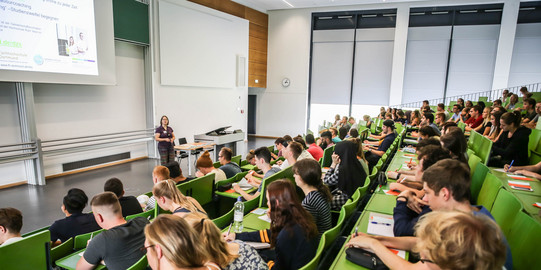 Students sit in a lecture at the beginning of the study.